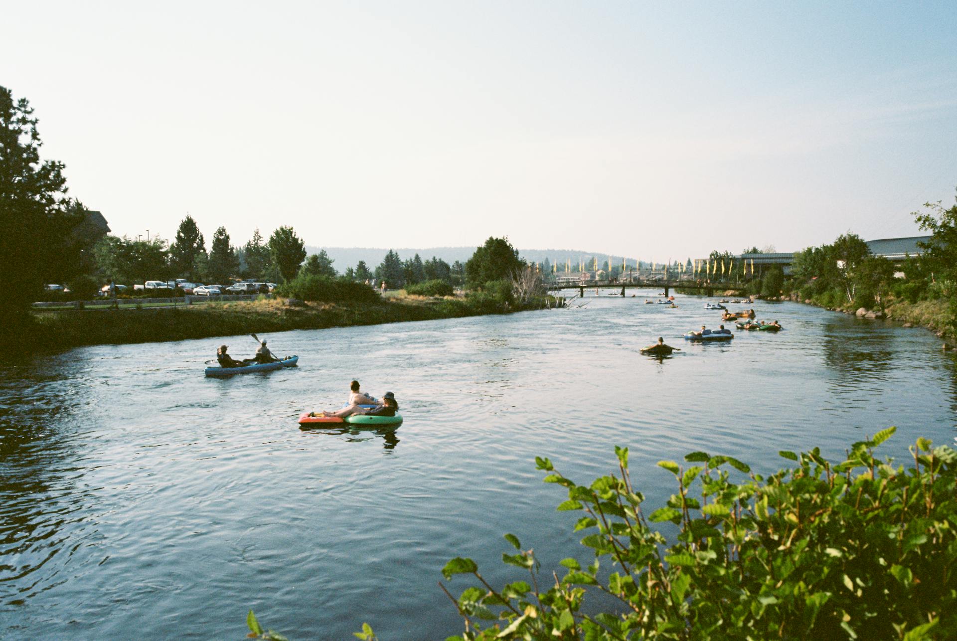 Classic picture of bend oregonian's floating the descutes river that runs through the old mill